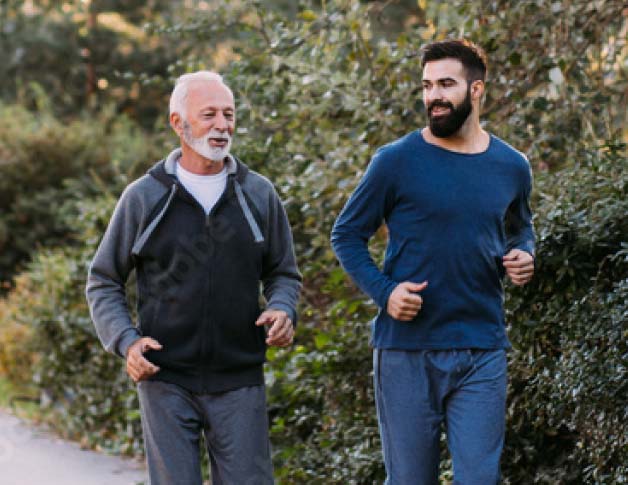 Two men running outside in exercise clothing